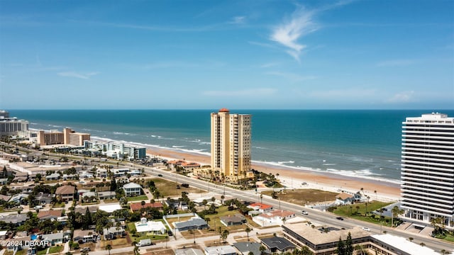 aerial view featuring a view of the beach and a water view