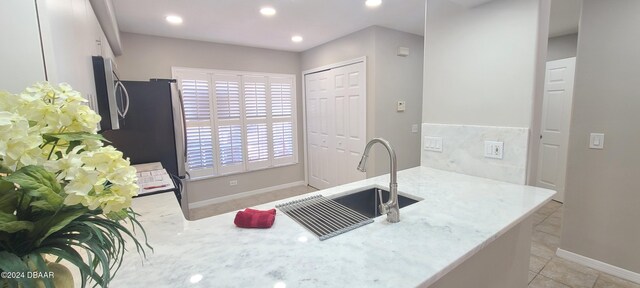 tiled spare room featuring french doors and ceiling fan