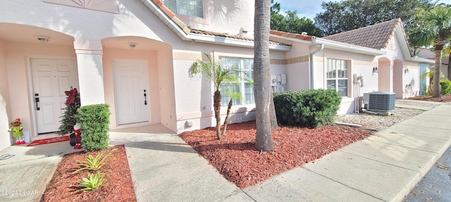 entrance to property featuring central AC