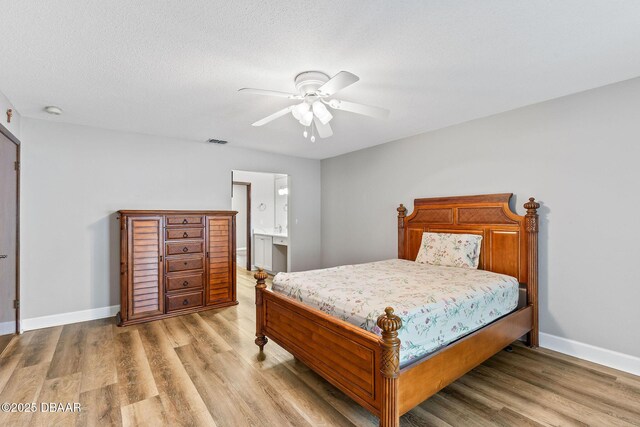12 Big Buck Trl, Ormond Beach, FL 32174 - bedroom featuring light wood finished floors, ensuite bathroom, and ceiling fan