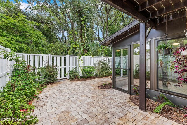 12 Big Buck Trl, Ormond Beach, FL 32174 - fenced backyard with a patio area