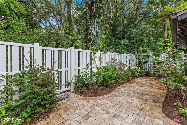12 Big Buck Trl, Ormond Beach, FL 32174 - fenced backyard with a patio