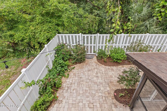 12 Big Buck Trl, Ormond Beach, FL 32174 - fenced backyard featuring a patio area