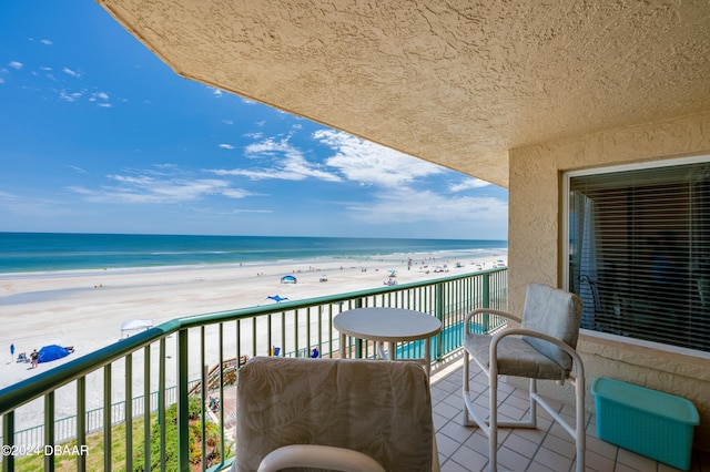 balcony with a view of the beach and a water view