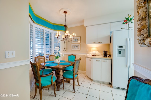 tiled dining space featuring an inviting chandelier and crown molding