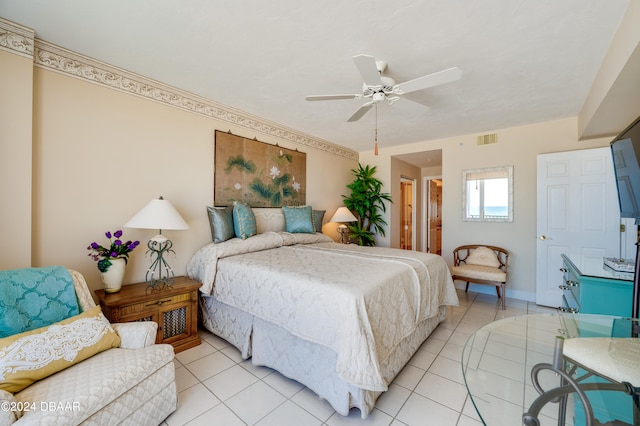 bedroom with ceiling fan and light tile patterned floors