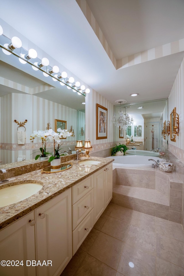 bathroom with vanity, tiled bath, and tile patterned floors