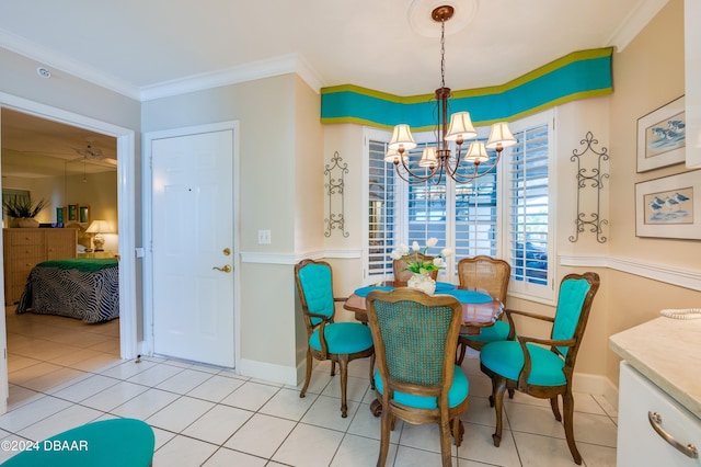 tiled dining space with a notable chandelier and crown molding