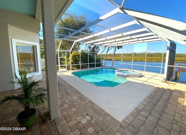 3 Tomoka View Dr, Ormond Beach, FL 32174 - view of swimming pool featuring a water view, a patio area, a pool with connected hot tub, and a lanai