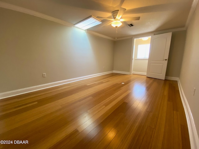 3 Tomoka View Dr, Ormond Beach, FL 32174 - unfurnished room with ceiling fan, baseboards, ornamental molding, and wood finished floors