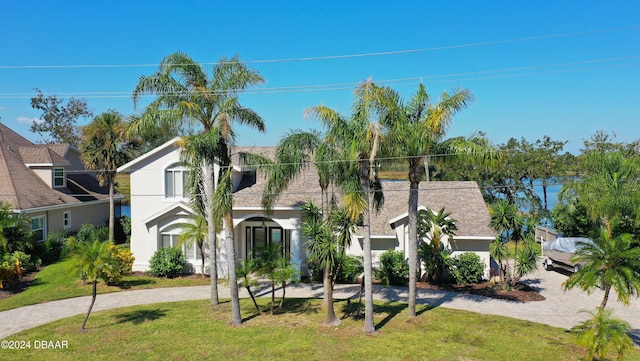 3 Tomoka View Dr, Ormond Beach, FL 32174 - view of front of property with stucco siding and a front lawn