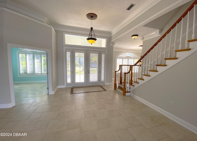 3 Tomoka View Dr, Ormond Beach, FL 32174 - foyer featuring french doors, plenty of natural light, crown molding, stairs, and baseboards