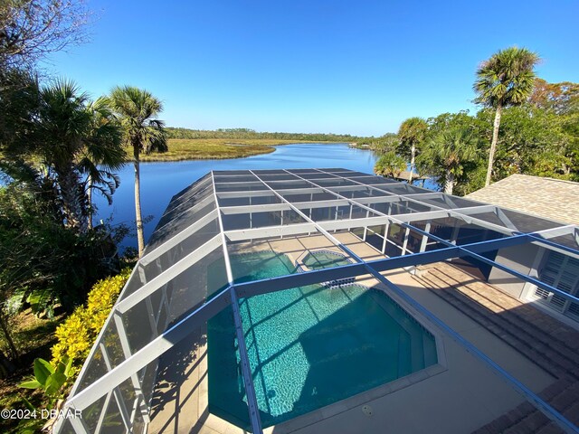 3 Tomoka View Dr, Ormond Beach, FL 32174 - outdoor pool with a water view, an in-ground hot tub, a lanai, and a patio