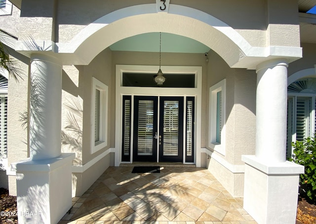 3 Tomoka View Dr, Ormond Beach, FL 32174 - entrance to property with stucco siding and french doors