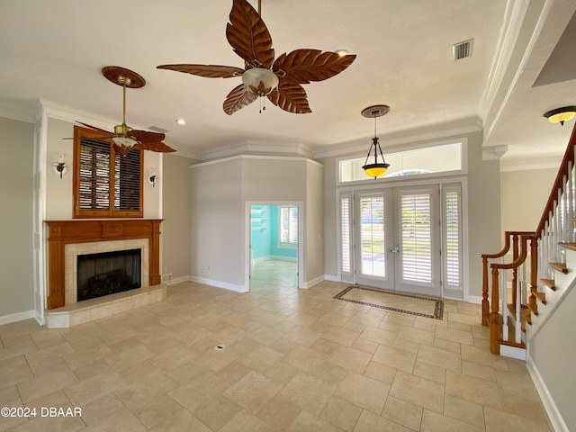 3 Tomoka View Dr, Ormond Beach, FL 32174 - unfurnished living room featuring french doors, ornamental molding, stairway, healthy amount of natural light, and a ceiling fan