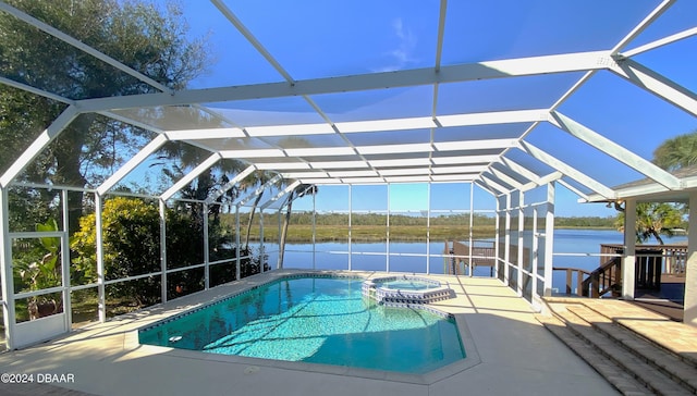 3 Tomoka View Dr, Ormond Beach, FL 32174 - view of pool featuring a water view, glass enclosure, a patio area, and a pool with connected hot tub