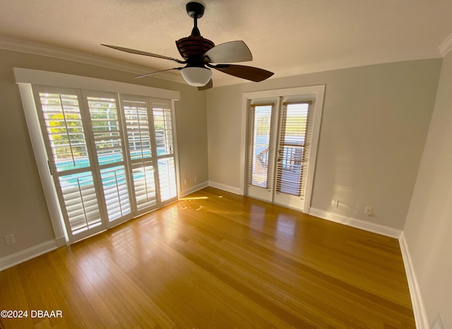 3 Tomoka View Dr, Ormond Beach, FL 32174 - unfurnished room featuring healthy amount of natural light, baseboards, wood finished floors, and ornamental molding