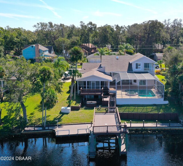 3 Tomoka View Dr, Ormond Beach, FL 32174 - rear view of house featuring a water view, a lawn, boat lift, and a patio area