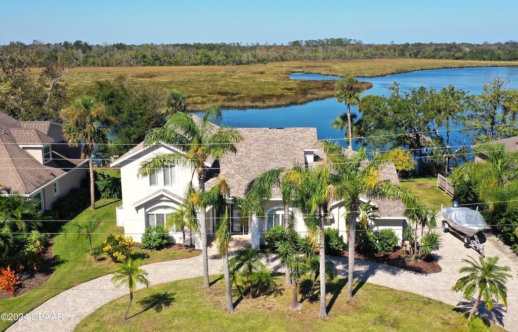 birds eye view of property with a water view