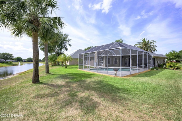 view of yard featuring a water view and an outdoor pool