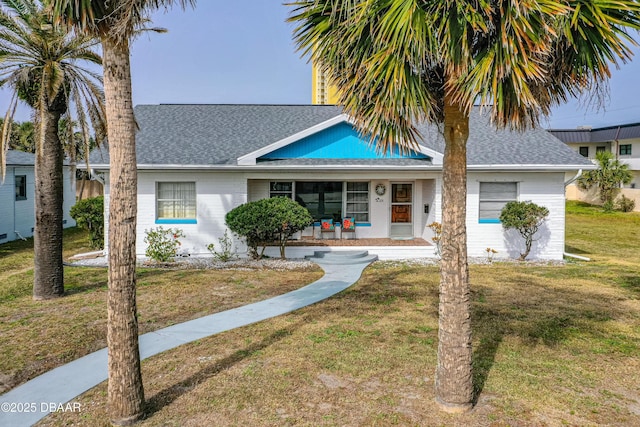 view of front of home featuring a front lawn and a porch