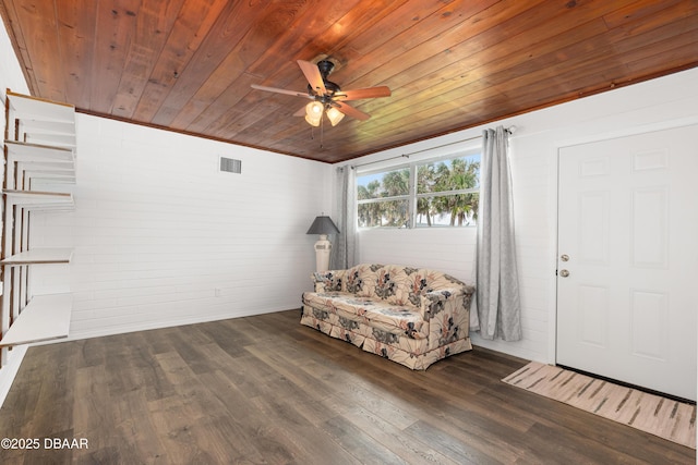 unfurnished room featuring wood ceiling, ceiling fan, and dark wood-type flooring