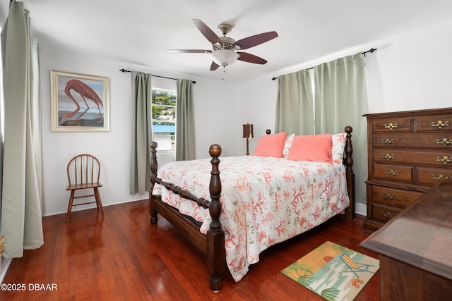 bedroom featuring ceiling fan and dark hardwood / wood-style flooring