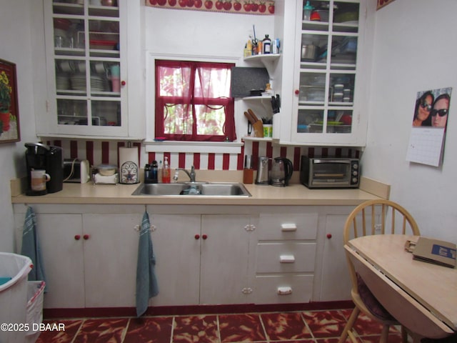 33 Hernandez Ave, Ormond Beach, FL 32174 - kitchen featuring light countertops and white cabinetry