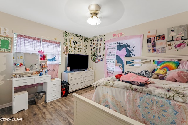 bedroom featuring hardwood / wood-style flooring and ceiling fan