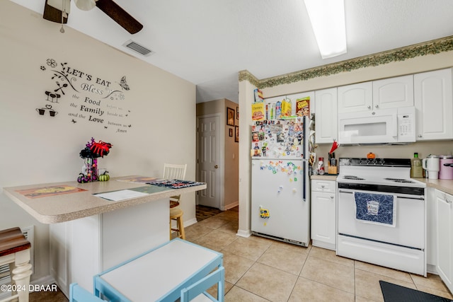 kitchen featuring white cabinets, white appliances, ceiling fan, and light tile patterned floors