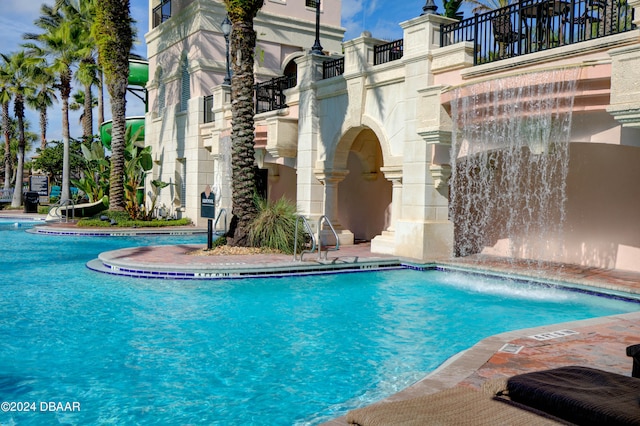 view of pool with pool water feature