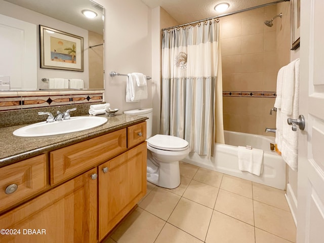 full bathroom featuring shower / tub combo with curtain, vanity, toilet, and tile patterned flooring