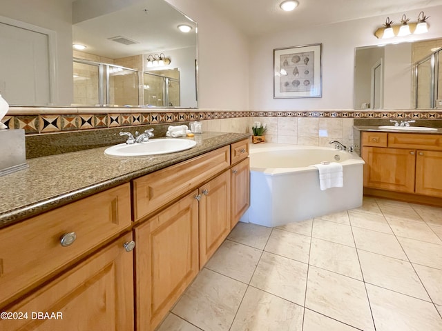 bathroom with vanity, tile patterned floors, and separate shower and tub