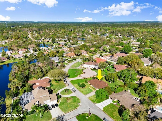 drone / aerial view featuring a residential view and a water view