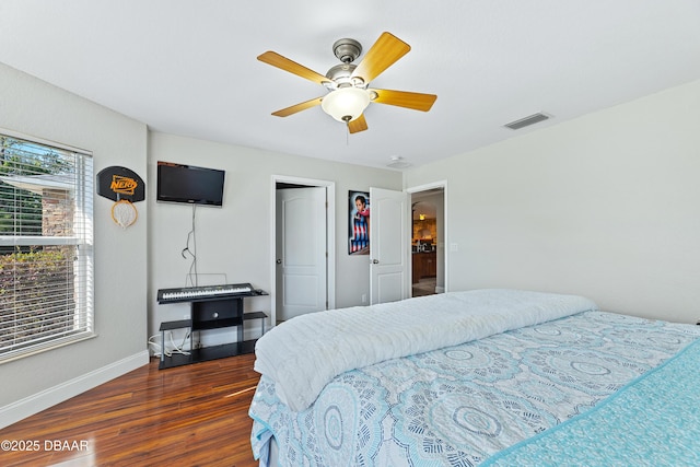 bedroom featuring ceiling fan and dark hardwood / wood-style floors