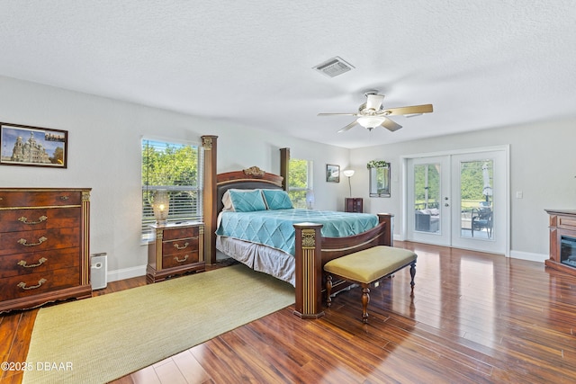 bedroom featuring hardwood / wood-style floors, ceiling fan, access to outside, and french doors