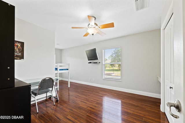 office area featuring ceiling fan and dark hardwood / wood-style flooring