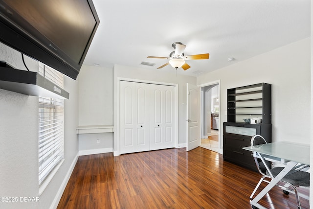 office area featuring ceiling fan and dark hardwood / wood-style floors