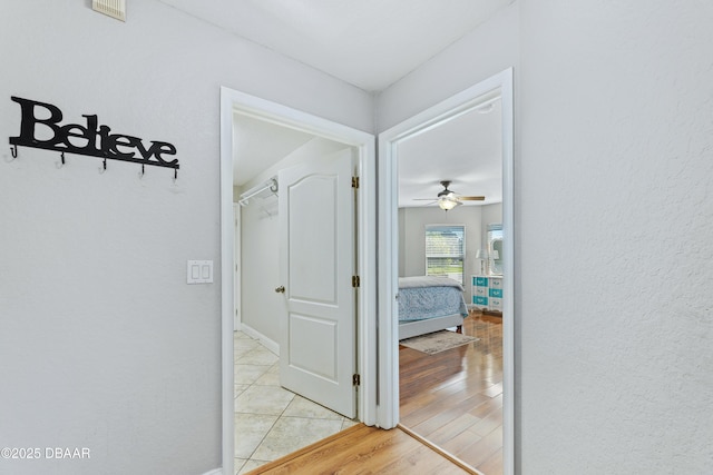 corridor featuring light hardwood / wood-style flooring