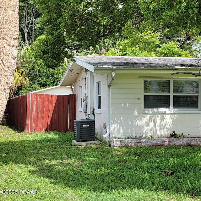 2344 Florida Blvd, South Daytona, FL 32119 - view of property exterior with a central AC unit and roof with shingles