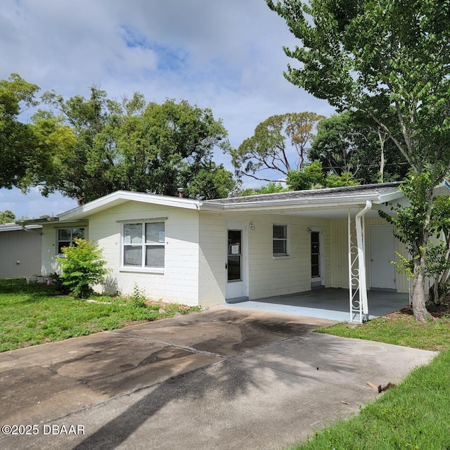 2344 Florida Blvd, South Daytona, FL 32119 - ranch-style home with driveway and an attached carport