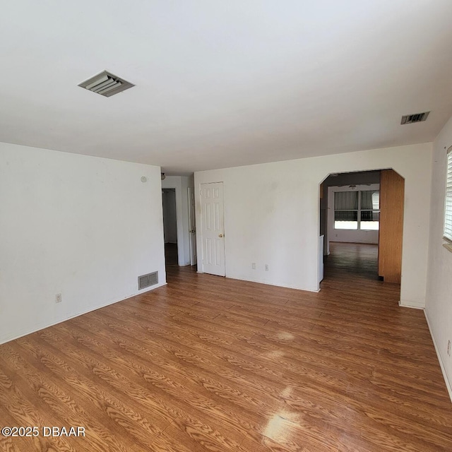 2344 Florida Blvd, South Daytona, FL 32119 - spare room featuring wood finished floors and arched walkways