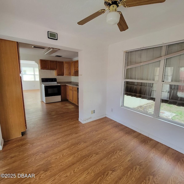 2344 Florida Blvd, South Daytona, FL 32119 - unfurnished living room featuring wood finished floors and a ceiling fan