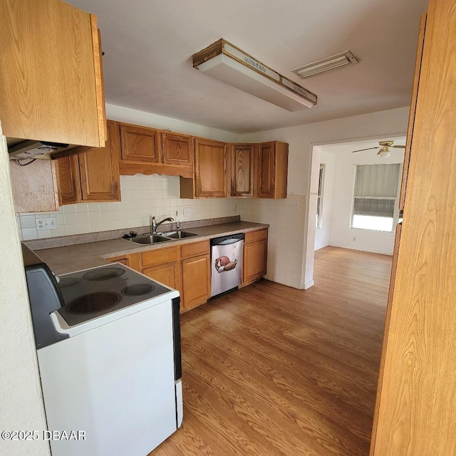 2344 Florida Blvd, South Daytona, FL 32119 - kitchen featuring white electric stove, stainless steel dishwasher, light wood finished floors, backsplash, and brown cabinets