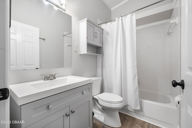 full bath with shower / tub combo, toilet, ornamental molding, vanity, and wood finished floors