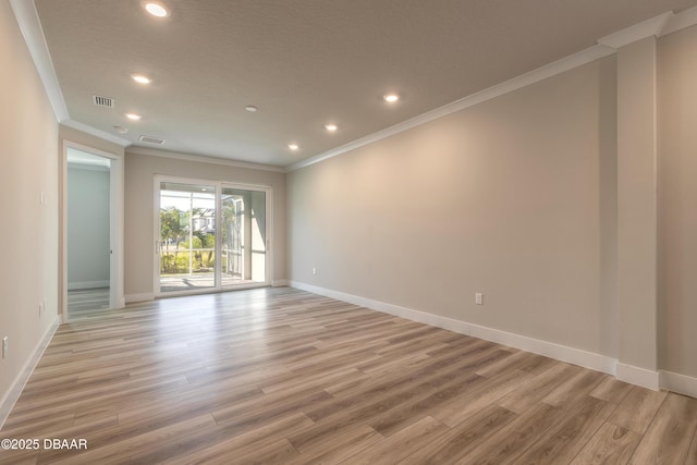 unfurnished room with light hardwood / wood-style floors and ornamental molding