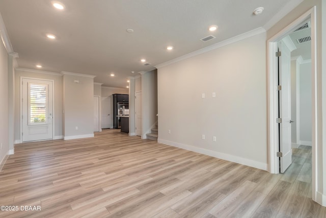 unfurnished living room featuring light hardwood / wood-style floors and crown molding