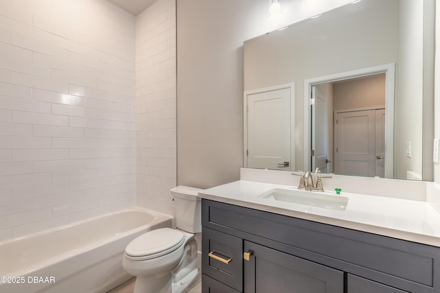 full bathroom with vanity, toilet, and tiled shower / bath