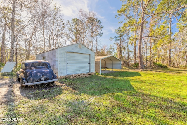 garage with a lawn and a carport