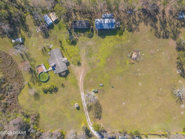 birds eye view of property with a rural view